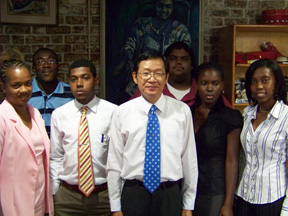 Taiwan ambassador to St. Vincent and the Grenadines, Leo Lee, pose with the scholarship recipients.