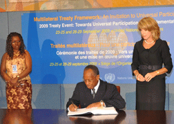 Sir Louis Straker signs the Convention on Cluster Munitions on Sept. 23. (Photo courtesy Permanent Mission of SVG to the UN)